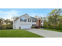 Traditional two-story home with a spacious front lawn and a long driveway at 15 Glen Echo Dr, Covington, GA 30016