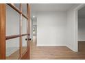 Bright foyer features hardwood floors and a view of the entry door at 5010 Hyde Way, Cumming, GA 30040