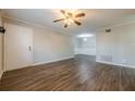 Open living space with hardwood floors, ceiling fan, and ample natural light at 1010 Scott Blvd # D8, Decatur, GA 30030