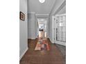 Inviting entryway featuring hardwood floors and view into other living spaces at 2650 Longacre Park Way, Lawrenceville, GA 30044