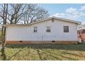 The back of this house is white with several windows and green grass at 340 Brooks Sw Ave, Atlanta, GA 30310
