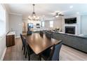 Inviting living space with a fireplace, dining table, and open kitchen layout at 3739 Silvery Way, Powder Springs, GA 30127