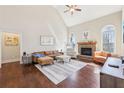 Spacious living room with vaulted ceilings, fireplace, and large windows providing natural light at 110 Canyon Ridge Trl, Canton, GA 30114
