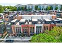 Modern townhomes with rooftop terraces, brick facades, and manicured landscaping at 1239 Chelsea Nw Cir, Atlanta, GA 30318
