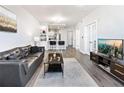 Open-concept living room with modern decor, hardwood floors, and kitchen view at 390 17Th Nw St # 5031, Atlanta, GA 30363
