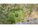 Aerial view of a well-manicured lawn and garden in a secluded backyard with mature trees at 2544 Brookdale Nw Dr, Atlanta, GA 30305