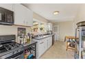 Functional kitchen featuring ample cabinet space and essential appliances under a window at 1277 Mcpherson Se Ave, Atlanta, GA 30316
