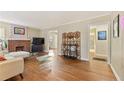 Bright living room with hardwood floors, a brick fireplace, and large windows with lots of natural light at 1277 Mcpherson Se Ave, Atlanta, GA 30316