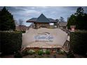 Stone sign for Crystal Lake Golf and Country Club nestled in a landscaped setting at 912 Fire Thorn Dr, Hampton, GA 30228