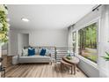 Bright living room showcasing a comfortable sofa, stylish decor, and a large window with scenic views at 3951 Covered Bridge Sw Rd, Smyrna, GA 30082