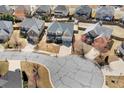 An aerial view of a beautiful home nestled in a friendly neighborhood with lush greenery at 1645 Renfroe Run, Cumming, GA 30041