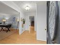 Inviting foyer featuring hardwood floors and views into a study and stairway at 3655 Autumn Ridge Pkwy, Marietta, GA 30066