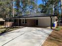 Inviting single-story home with a spacious carport and a well-manicured lawn at 4430 Locksley Rd, Tucker, GA 30084