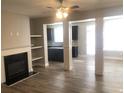 Open-concept living room featuring hardwood floors and natural light at 849 Arbor Crowne Dr, Lawrenceville, GA 30045