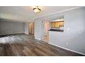 Bright open concept living room with modern flooring, neutral paint colors, bar seating and lots of natural light at 3301 Henderson Mill Rd # F1, Atlanta, GA 30341
