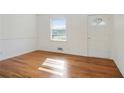 Bright living room featuring gleaming hardwood floors, fresh paint, and natural light at 5205 Dunmoreland Ct, Atlanta, GA 30349