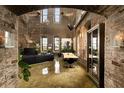 Unique living space showcasing exposed brick, high ceilings, and an open floor plan at 170 Boulevard Se # H523, Atlanta, GA 30312