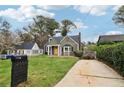 Home exterior showcasing the front yard, a long driveway, and a manicured lawn at 2654 Jefferson Ter, Atlanta, GA 30344