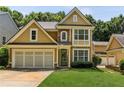 Inviting home with a two-car garage, attractive siding, and well-kept lawn at 3277 Wyesham Cir, Duluth, GA 30096