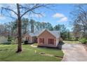 Charming ranch-style home with a well-manicured lawn, and inviting curb appeal at 100 Cowan Trl, Stockbridge, GA 30281