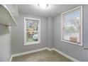 Sunlit bedroom with two windows and neutral-toned walls at 3020 Harold Se Ave, Atlanta, GA 30316