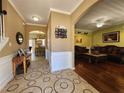 Welcoming foyer featuring decorative tile flooring, archways, and views into the living room and kitchen area at 2702 Brookefield Nw Ln, Kennesaw, GA 30152