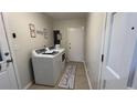 Functional laundry room with washer, dryer, and storage space at 1027 Goza Rd, Fayetteville, GA 30215