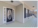 Charming front porch with oval glass front door and black shutters, offering inviting curb appeal at 313 Sable Trace Pass, Acworth, GA 30102