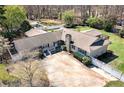 Beautiful ranch home with swimming pool, large driveway, and well-maintained landscaping at 115 Heritage Cir, Mcdonough, GA 30253