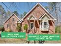 Charming brick home with a manicured lawn, separate living quarters, and a private entry at 3550 Gravitt Rd, Cumming, GA 30040