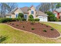Stunning two-story house with a well-maintained lawn, complemented by a two-car garage at 4441 Langdon Se Walk, Smyrna, GA 30080