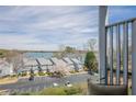 Balcony view showcasing townhomes, lake views, and parking for convenient and scenic living at 2300 Habersham Marina Rd # 201, Cumming, GA 30041