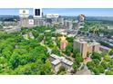 Aerial view showcases the property's prime location, surrounded by lush greenery, city amenities, and popular landmarks at 2965 Pharr Court South Nw # 102, Atlanta, GA 30305