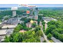 Aerial view highlighting the property's proximity to local shopping, restaurants, and the serene Duck Pond Park at 2965 Pharr Court South Nw # 102, Atlanta, GA 30305