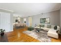 Spacious living room with hardwood floors and an open dining area at 1150 Collier Nw Rd # J11, Atlanta, GA 30318