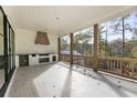 Covered back porch with an outdoor kitchen and built-in grill at 128 Owens Mill Pl, Canton, GA 30115