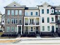 Charming townhome showcases a mix of brick and siding with a balcony at 2410 Edgar Park Pl # 104, Duluth, GA 30096