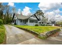 Charming single-story home featuring a long driveway and a freshly painted exterior at 984 Cascade Sw Rd, Atlanta, GA 30311