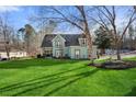 Inviting two-story house with green lawn at 1206 Red Fox Cir, Woodstock, GA 30188