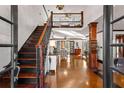 Grand foyer with staircase, wood floors, and abundant natural light at 1206 Red Fox Cir, Woodstock, GA 30188
