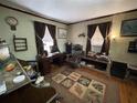 Home office featuring a desk, leather chair, and natural light from the window at 3291 Peachtree St, Lithia Springs, GA 30122