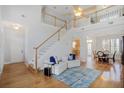 Inviting foyer with hardwood floors, staircase, an airy feeling and an open floor plan at 5085 Hampton Bluff Ct, Roswell, GA 30075