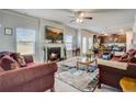 Inviting living room with fireplace, recessed lighting, and open layout to the kitchen at 104 Camilla Dr, Carrollton, GA 30116
