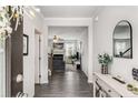 Inviting entryway with wood floors, a view to the living room, and stylish decor at 224 Shoals Bridge Rd, Acworth, GA 30102