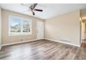Bright living room featuring new flooring, fresh paint, ceiling fan, and plenty of natural light at 869 Capitol View Nw Ave, Atlanta, GA 30318