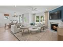 Bright living room featuring a fireplace, hardwood floors, and stylish furniture at 808 Tupelo Way, Villa Rica, GA 30180