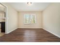 Bright dining room with wood laminate flooring and a window offering plenty of natural light at 2339 Chevy Chase Ln, Decatur, GA 30032
