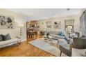 Bright living room featuring hardwood floors, neutral furniture, and an open floor plan at 746 Amsterdam Ave, Atlanta, GA 30306