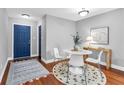 Cozy dining room with hardwood floors and stylish decor, accentuated by natural light at 8303 Santa Fe Pkwy, Atlanta, GA 30350