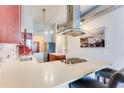 Stylish kitchen with a center island, cherry cabinets, and a modern vent hood at 3820 Roswell Ne Rd # 902, Atlanta, GA 30342